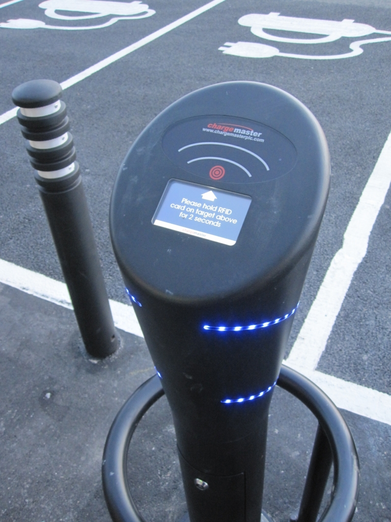 Electric car charging point in use